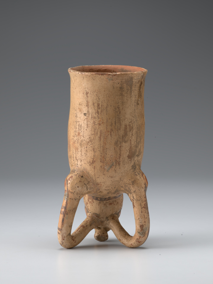 A drinking vessel with the head and front legs of a pig-like animal.