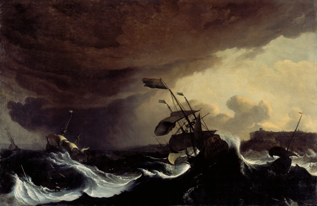 Barcos en un mar tormentoso frente a una costa