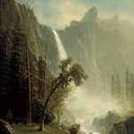 A vertical landscape painting of a waterfall rushing over a rocky cliff. The white water creates a cloud of spray as it falls into a rocky riverbed. Tall pine trees stand among the rocks on either side of the river. There are two deer in the grass at the bottom left corner. At the top of the painting, there is a small section of blue sky above a cliff.