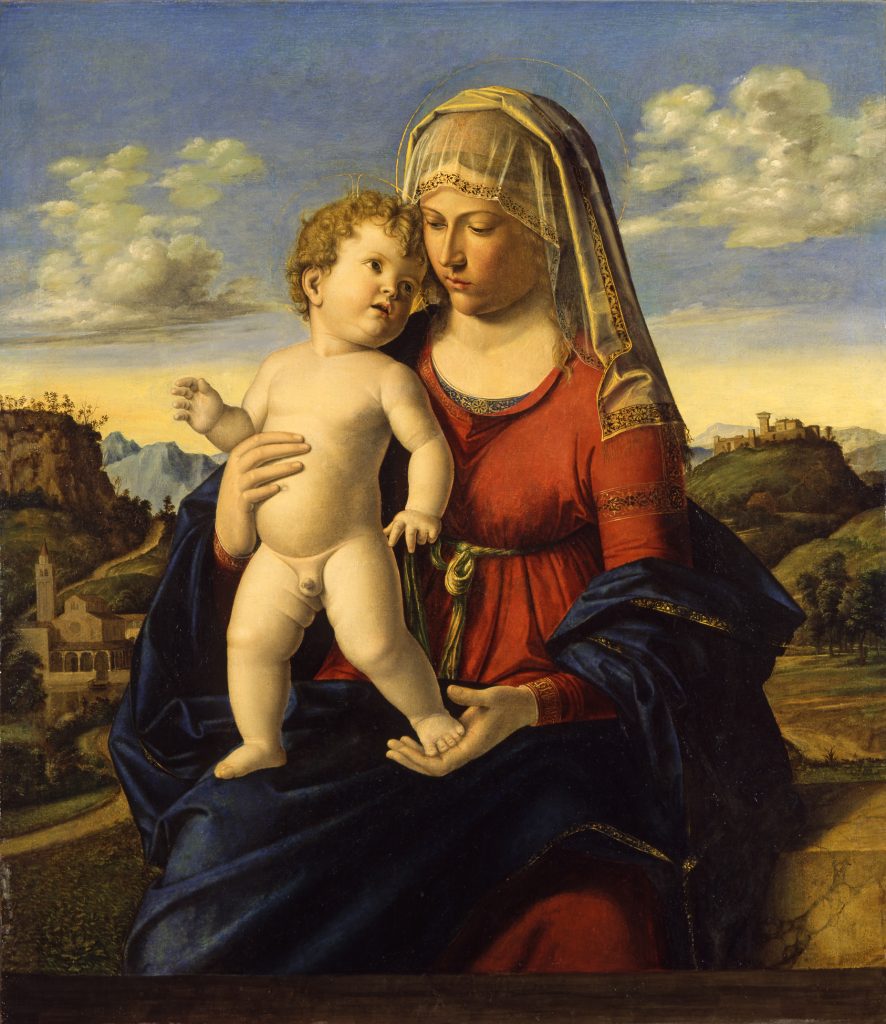 The Virgin Mary sits on a hillside with an Italian landscape behind her and the infant Jesus Christ standing on her lap. She wears deep blue and red garments with a white head covering.