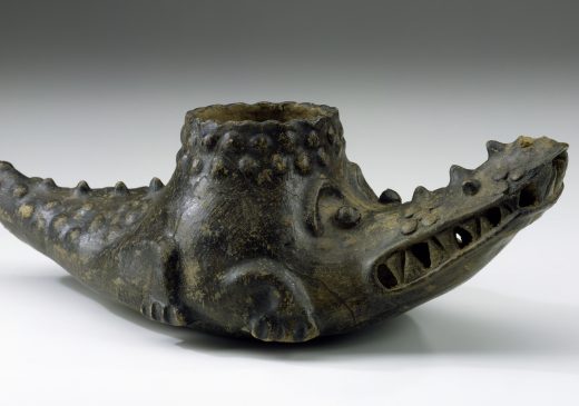 A crocodile-shaped ceramic vessel.