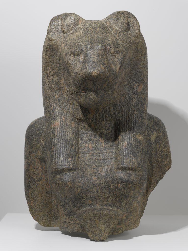 A granite sculpture of the upper torso, chest, and shoulders of a woman and the head of a lioness.