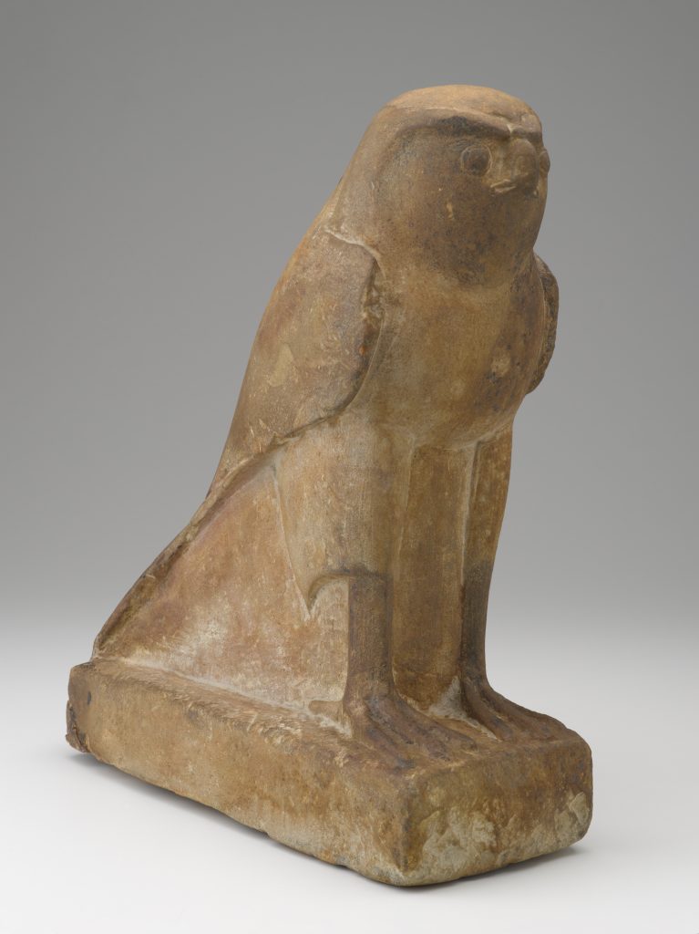 A stone sculpture of a falcon.