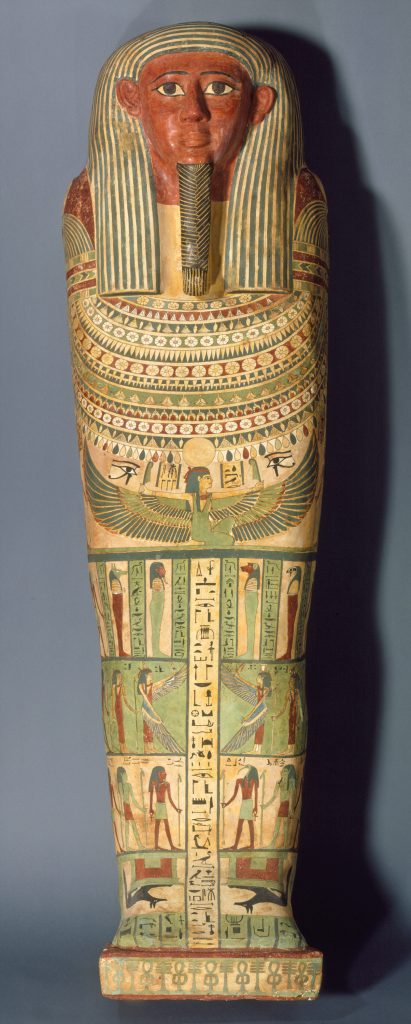 A wooden coffin shaped like a human body, with ancient Egyptian symbols and deities painted on its surface.