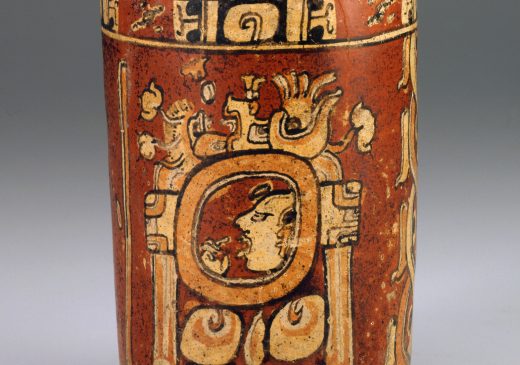 A clay jar or vase decorated with Maya symbols.