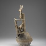 Side view of a ceramic incense burner that shows the supports for stacked elements.