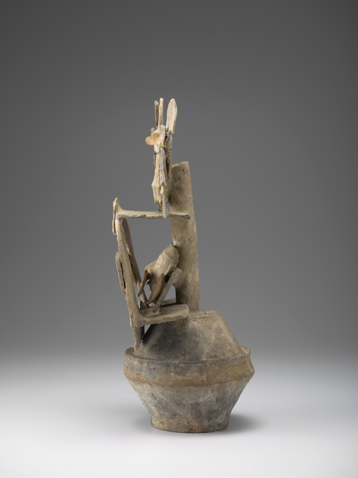 A ceramic incense burner with a bowl-like base and two levels of decorative elements that include a warrior figure, four columns, and two birds.