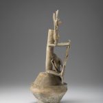 Side view of a ceramic incense burner that shows the supports for stacked elements.