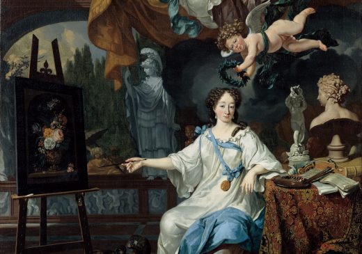 An oil painting of a female artist seated beside a table in her studio. She is wearing a white and blue dress that is decorated with ribbons and a gold medallion. She is holding a paintbrush toward a canvas and is surrounded by sculptures and statues. Two angel figures are depicted flying above her. The smaller figure is placing a wreath on top of the woman’s head.