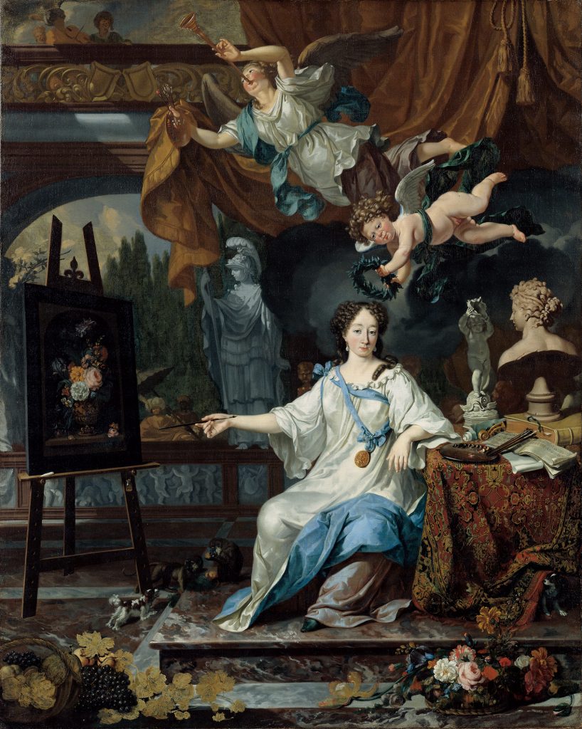 An oil painting of a female artist seated beside a table in her studio. She is wearing a white and blue dress that is decorated with ribbons and a gold medallion. She is holding a paintbrush toward a canvas and is surrounded by sculptures and statues. Two angel figures are depicted flying above her. The smaller figure is placing a wreath on top of the woman’s head.