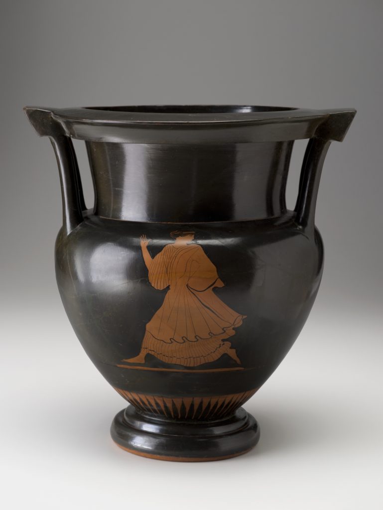 A black vase featuring red-colored male and female figures. The figures depict the ancient Greek god Poseidon chasing a young woman on one side of the vase and a woman running away from him on the other side.