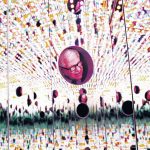 Director Larry Wheeler peers inside the sculpture Light of Life by Yayoi Kusama