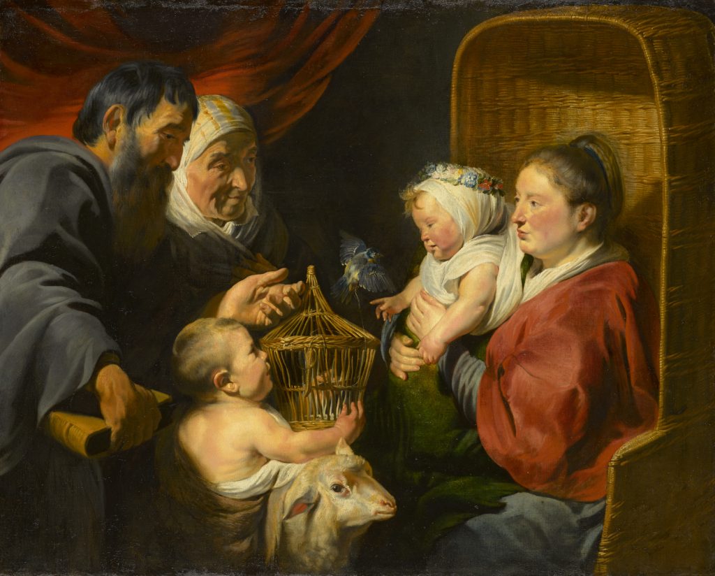 An oil painting of a group of five people gathered together. On the left is a woman wearing a white veil, standing beside a bearded man who is wearing a dark gray robe. To their right is a seated infant and with a lamb beside him. On the left side of the painting, a woman draped in red fabric is seated in a tall wicker chair. On her lap she holds an infant wearing white robes and a crown of flowers. In the center of the painting there is a gold birdcage with a bird flying out of it.