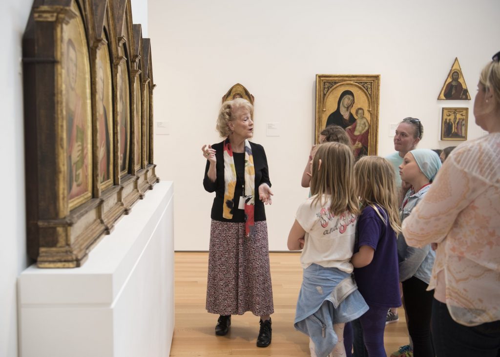 A five-panel painting featuring Christ blessing the viewer, surrounded by St. John the Evangelist, the Virgin Mary, St. John the Baptist, and St. Francis on gold leaf backgrounds.