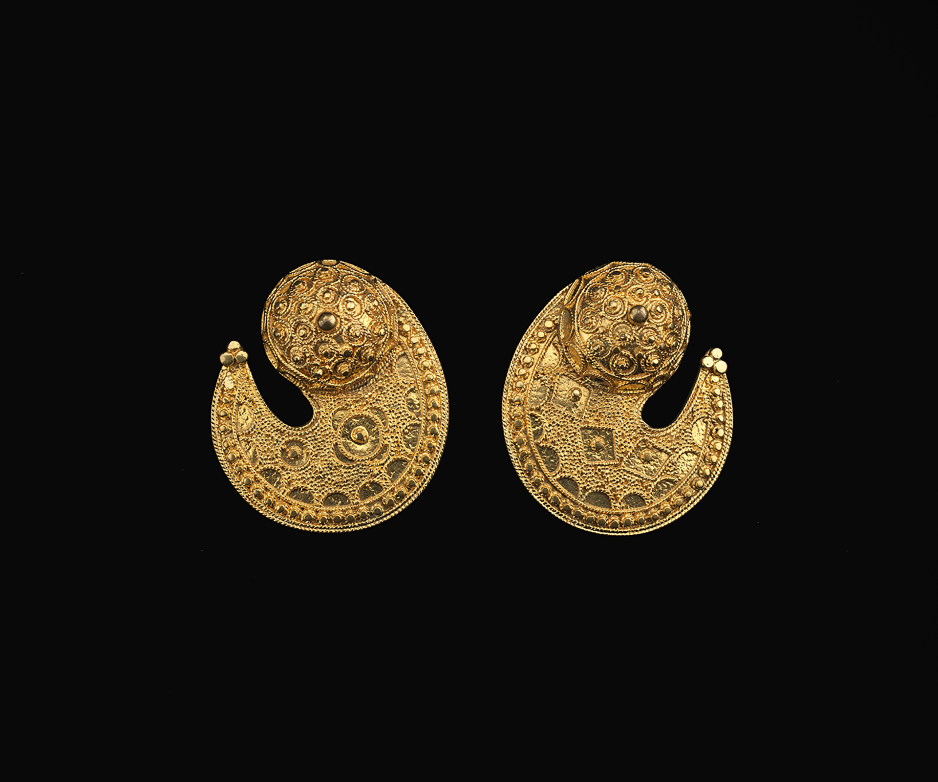 Earrings "Tukulor artist; Senegal; Late 20th century; Gold; A: 3.9 x 3.5 x 2.4 cm (1 9/16 x 1 3/8 x 15/16 in.) B: 3.9 x 3.4 x 2.3 cm (1 9/16 x 1 5/16 x 7/8 in.)"