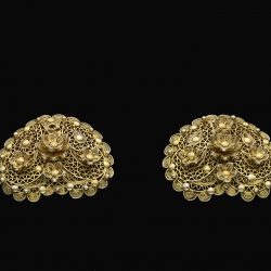 gold earrings with decretive flowers and patterns