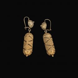 cylinder hollow earrings made of gold with intricate design