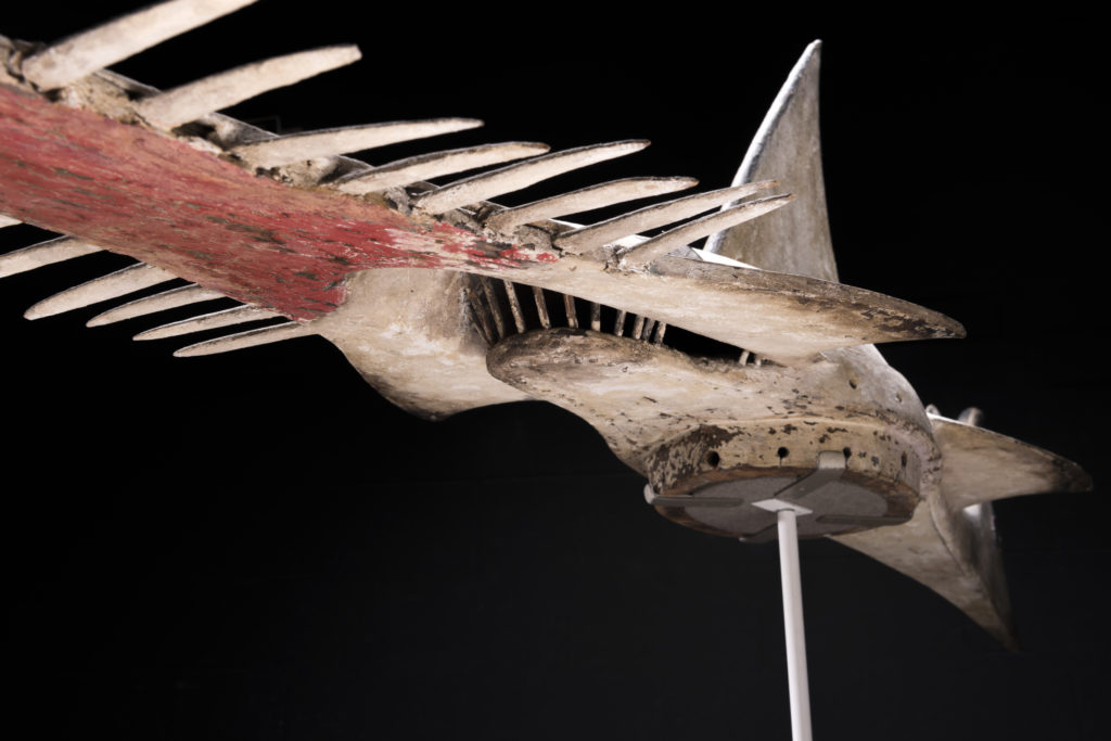 A wooden headdress in the shape of a sawfish.