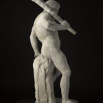A white marble sculpture of a nude, bearded male figure holding a club over his shoulder. His weight is supported by a tree trunk behind him. Alternate view.