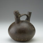 A large, oval-shaped ceramic jar with an open spout on top.