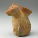 A ceramic vessel shaped like a dog.