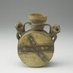 A ceramic vessel featuring a pair of monkeys with their hands covering their mouths. Their tails curve upward and connect with the neck of the vessel, serving as handles.