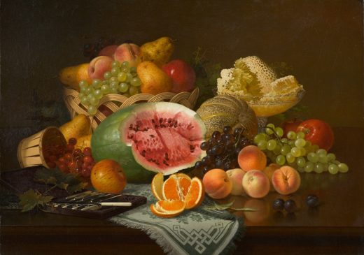 An oil painting of a watermelon, peaches, oranges, grapes, pears, and other fruit displayed on a wooden table. There is a glass bowl filled with pieces of a honeycomb on the right. On the left there is a set of knives with white handles.