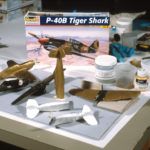During conservation work, using a plastic model and other materials to reproduce the missing airplanes and broken parts.