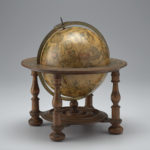 This is a seventeenth-century globe on a wooden stand which shows the European world view along with the constellations. Alternate view.