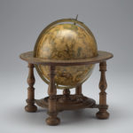 This is a seventeenth-century globe on a wooden stand which shows the European world view along with the constellations.