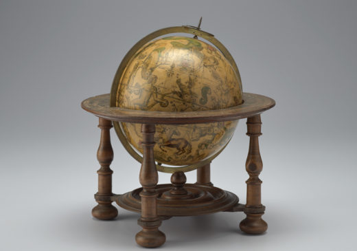 This is a seventeenth-century globe on a wooden stand which shows the European world view along with the constellations.