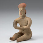 A photo of an Olmec style ceramic seated figure