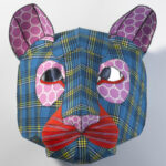 Front view of a mixed media scupture of a lion's head.