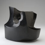 An abstract stone sculpture made from black granite