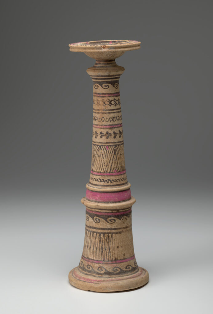 Beige ceramic cylindrical incense burner with a flared base topped with a broad-lipped bowl