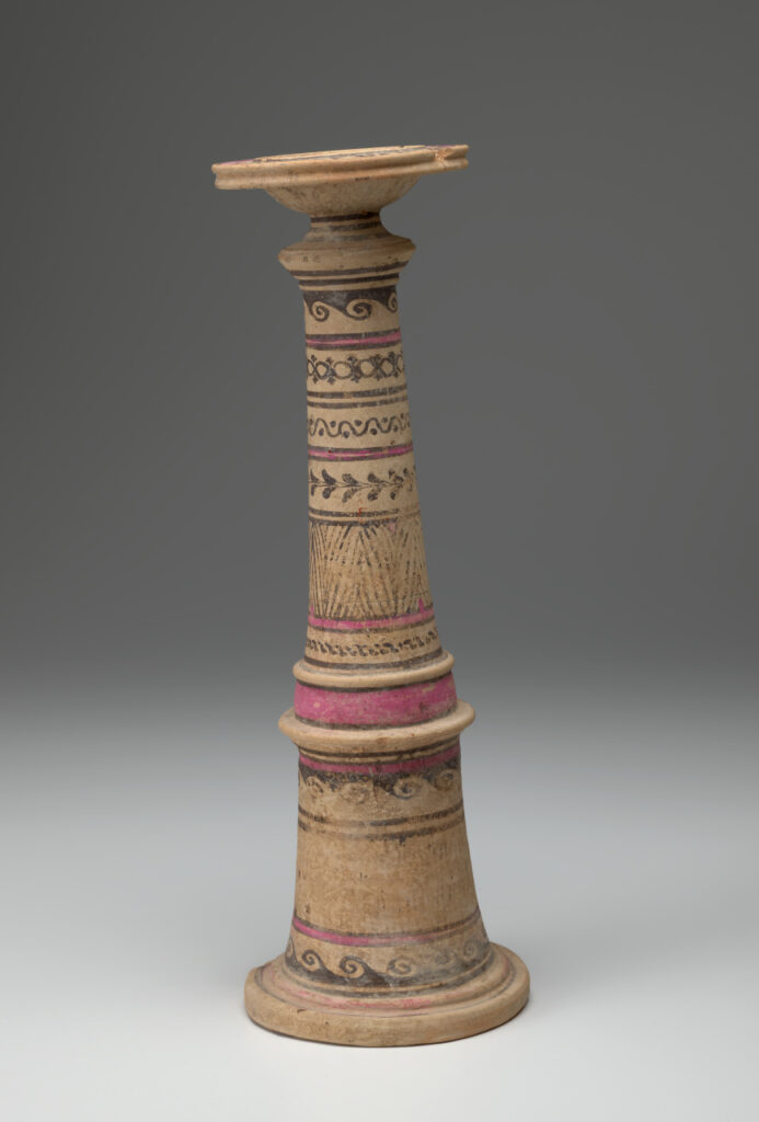 Beige ceramic cylindrical incense burner with a flared base topped with a broad-lipped bowl