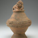 Reddish-brown ceramic incense burner bowl with a crested crocodile figure on top of the lid
