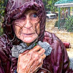 An older woman holds her raincoat around her body as flood waters rise in the background