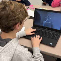 Student looking at a laptop