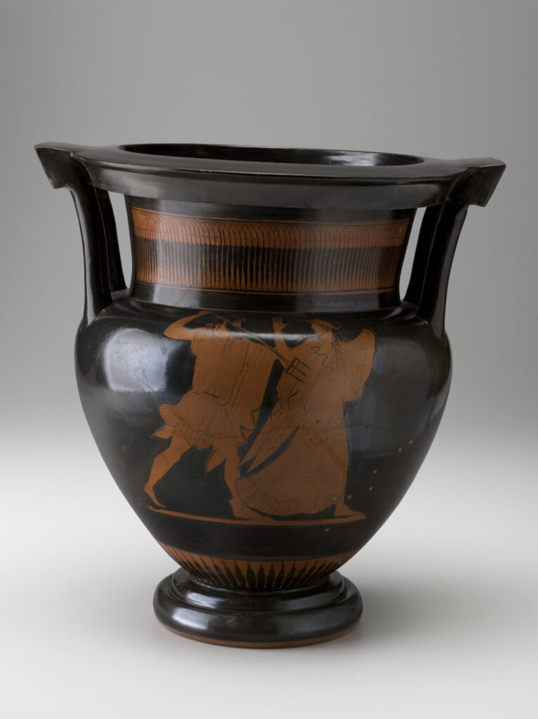 Shiny black ceramic vessel with two handles shows a painted reddish-brown design of a bearded man chasing a woman with a three-pronged spear.